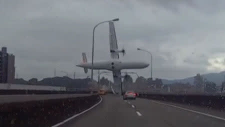 A still image taken from an amateur video shot by a motorist shows a TransAsia Airways plane cartwheeling over a motorway soon after the turboprop ATR 72-600 aircraft took off in New Taipei City February 4, 2015. REUTERS/AMVID via Reuters TV