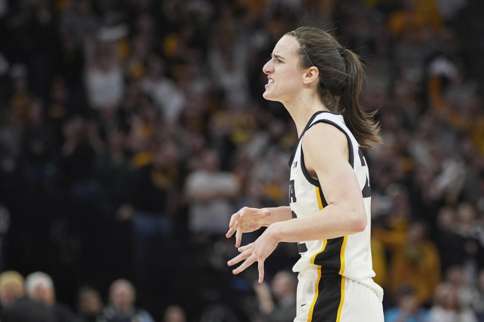 Iowa guard Caitlin Clark celebrates during overtime of an NCAA college basketball game against Nebraska in the final of the Big Ten women's tournament Sunday, March 10, 2024, in Minneapolis. (AP Photo/Abbie Parr)