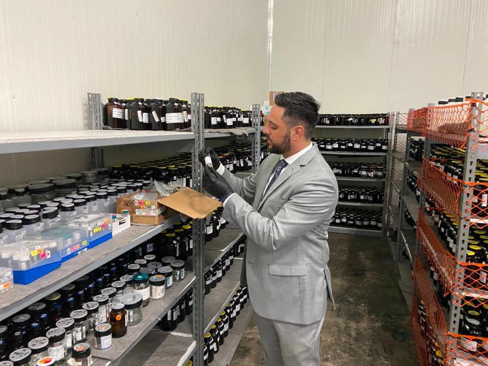 Dylan Boigris, a Coconut Grove trial attorney, inspects samples from the 2010 BP Deepwater Horizon oil spill that are being stored in a South Florida warehouse. 