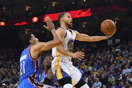 January 18, 2017; Oakland, CA, USA; Golden State Warriors guard Stephen Curry (30) shoots the basketball against Oklahoma City Thunder forward Andre Roberson (21) during the first quarter at Oracle Arena. Mandatory Credit: Kyle Terada-USA TODAY Sports