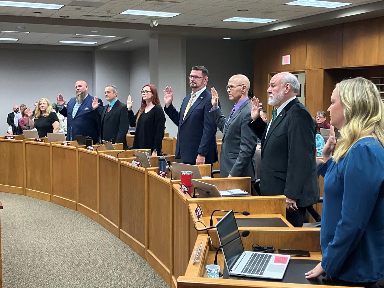 Eleven members of the Green Bay City Council take the oath of office during the council meeting Tuesday.