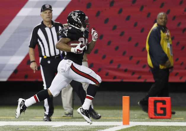 Devonta Freeman and his multidimensional scoring gets the ball rolling on Round 2. (AP)