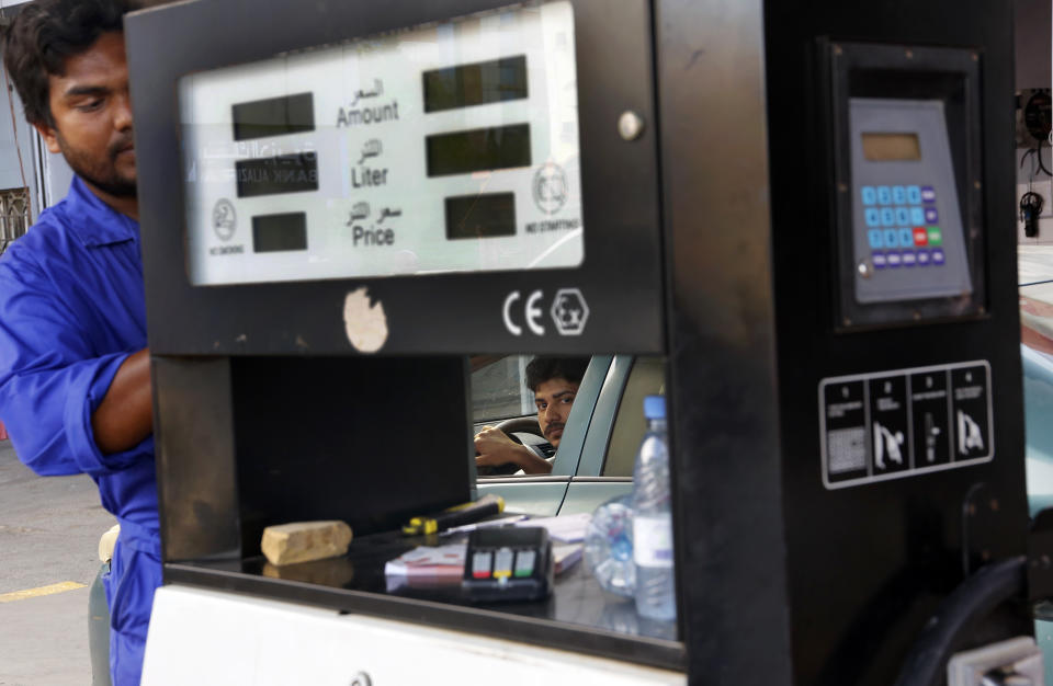A worker fills a car at a gas station in Jiddah, Saudi Arabia, Tuesday, Sept. 17, 2019. U.S. President Donald Trump declared Monday that it "looks" like Iran was behind the explosive attack on Saudi Arabian oil facilities. He stressed that military retaliation was not yet on the table in response to the strike against a key U.S. Mideast ally. (AP Photo/Amr Nabil)