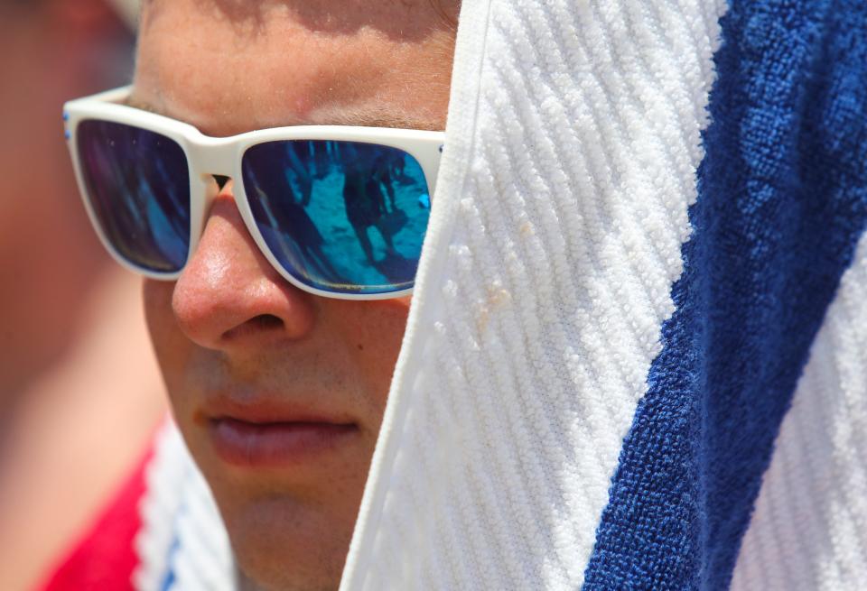 Matthew Mazur of the Town of Hempstead (NY) lifeguard team listens to instructions before an event in the Mid-Atlantic Regional Lifeguard Championships in Rehoboth Beach, Wednesday, July 13, 2022.