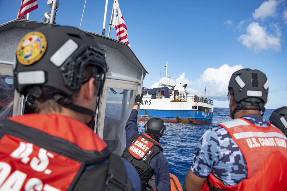 In this photo made available by the U.S. Coast Guard, the crew of the Coast Guard Cutter Stratton conducts patrols in Fiji's exclusive economic zone with Fijian law enforcement personnel in February 2022. The U.S. partnership with Fiji is one of 11 between the U.S. and Pacific Island countries, with a possible 12th on the horizon — each meant to stave off the economic collapse and regional instability that could follow if waters are fished to depletion. (CGC Stratton/U.S. Coast Guard via AP)