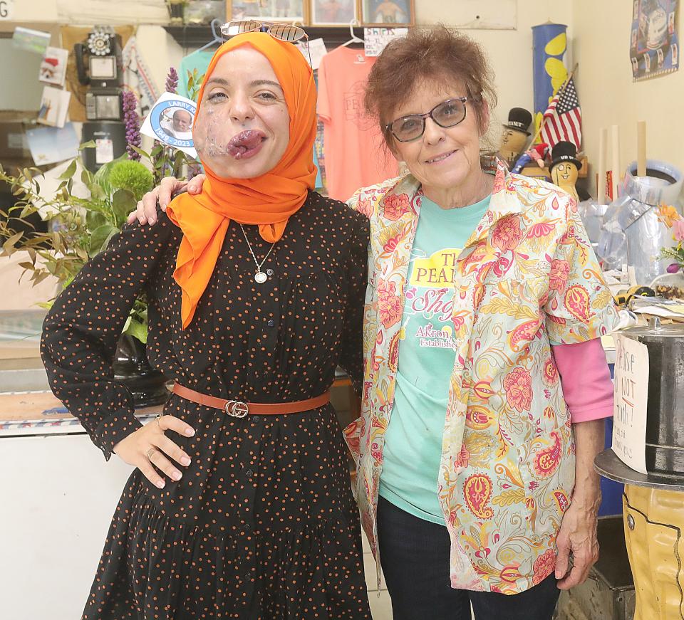Lamise ElBetar stopped in at The Peanut Shoppe downtown for a quick photo with owner Marge Klein before leaving Akron and the country.