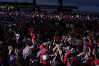 Supporters of President Donald Trump listen as he speaks during a campaign rally at MBS International Airport, Thursday, Sept. 10, 2020, in Freeland, Mich. (AP Photo/Evan Vucci)