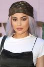 <p>A smoked-out taupe eyeshadow, rose lipstick, snatched eyebrows, and pastel wig topped off with a Louis Vuitton scarf.</p>