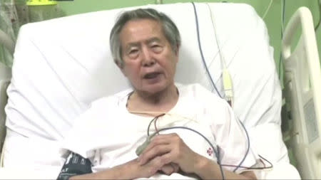 Peru's former President Alberto Fujimori asks for forgiveness from Peruvians as he lies in hospital bed in Lima, Peru, in this still image taken from a video posted on Facebook on December 26, 2017. Fujimori Handout/Reuters TV via REUTERS