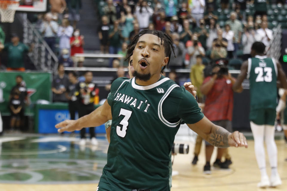 Hawaii guard JoVon McClanahan (3) reacts after making the winning shot over SMU to win the Diamond Head Classic NCAA college basketball game, Sunday Dec. 25, 2022, in Honolulu. Hawaii defeated SMU 58-57. (AP Photo/Marco Garcia)