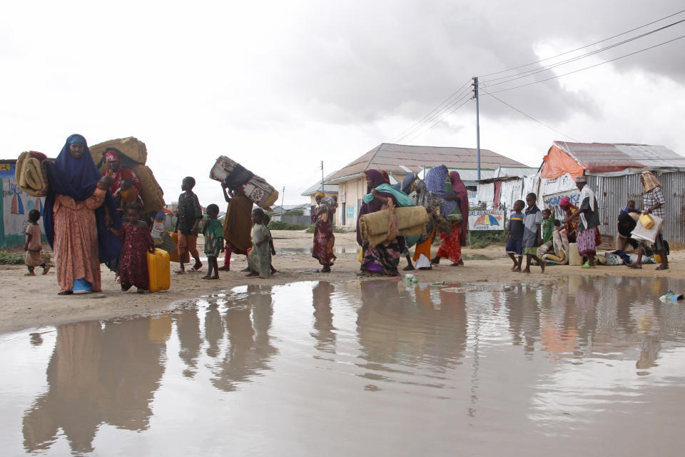 FILE - Displaced Somali vacate their camps after heavy floods entered their makeshift shelter in Mogadishu, Somalia, Monday, Nov. 13, 2023. A closely watched survey shows that efforts to fight public-sector corruption are failing to progress around the world, with a decline in the functioning of justice systems contributing to the malaise. Denmark led the index for the sixth consecutive year, followed by Finland and New Zealand. At the other end, Somalia again placed last. (AP Photo/Farah Abdi Warsameh, File)