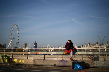 A climate change activist is seen during an Extinction Rebellion protest at Waterloo Bridge in London, Britain April 19, 2019. REUTERS/Hannah McKay