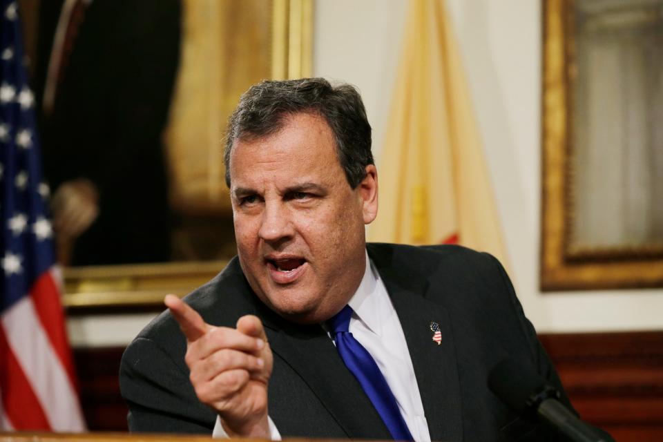 In this Dec. 13, 2013, file photo, NJ Gov. Chris Christie reacts to a question after announcing Deborah Gramiccioni is replacing Bill Baroni as deputy executive director of The Port Authority of New York & New Jersey during a news conference at the Statehouse in Trenton, N.J. The former two-term Republican governor's official portrait by Australian artist Paul Newton will cost $85,000, The Record reported Thursday, April 19, 2018, more than taxpayers shelled out for paintings of his three Democratic predecessors combined. Jon Corzine, Richard Codey and Jim McGreevey spent a combined $74,500 for theirs. None served two terms.
