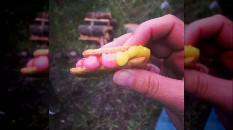 Starburst s'mores between fingers