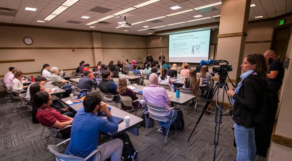 Bryan Hudson and Ashleigh Surma, linguists for The Language Conservancy, give a presentation on tools to help collect language data during the ICILDER on Friday.