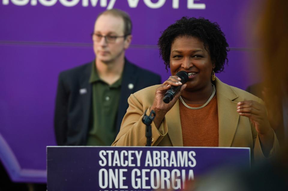 Candidate for Georgia Governor Stacy Abrams claps during the Stacy Abrams "Let's Get It Done" bus tour stop at IBEW Local 1579 in Augusta, Ga., on Oct. 27, 2022. Hundreds turned out to hear the gubernatorial candidate speak.
