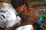 <p>Olympic champion Teddy Riner kisses his son Eden after his Men’s +100kg Judo final match on Day 7 of the Rio 2016 Olympic Games at Carioca Arena 2 on August 12, 2016 in Rio de Janeiro, Brazil. (Photo by Pascal Le Segretain/Getty Images) </p>