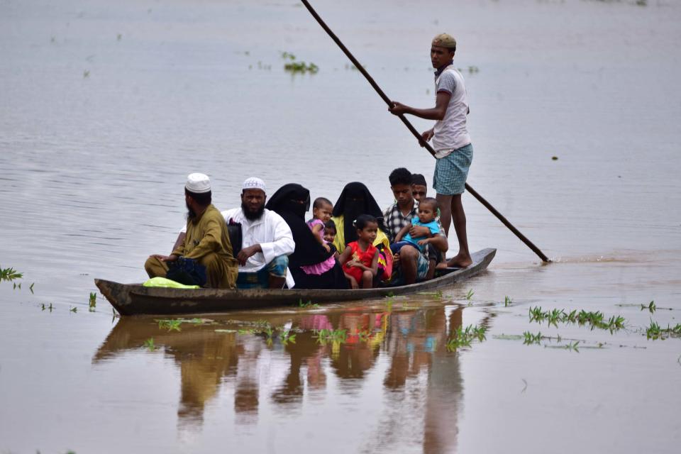 NAGAON,INDIA-JULY 22,2020 :Flood affected villagers are transported on a boat towards a safer place at a village in Nagaon district of Assam ,India - PHOTOGRAPH BY Anuwar Ali Hazarika / Barcroft Studios / Future Publishing (Photo credit should read Anuwar Ali Hazarika/Barcroft Media via Getty Images)