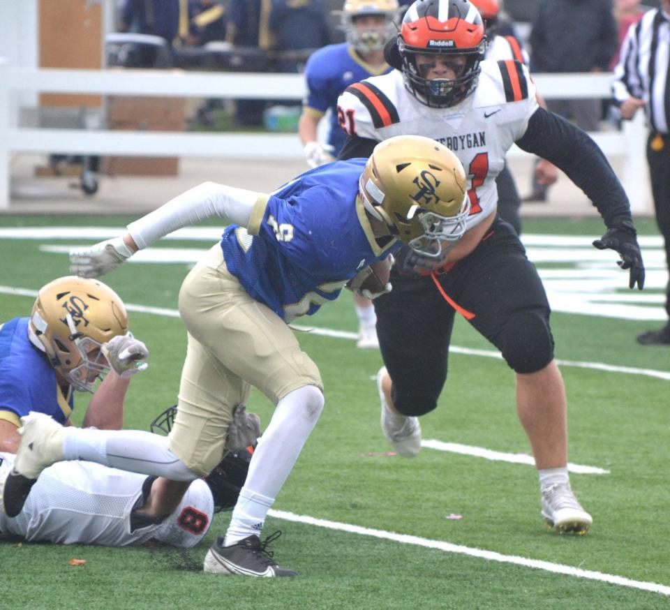 Cheboygan junior linebacker Gauge Ginop (21) prepares to tackle a Traverse City St. Francis player during a game in October. Ginop earned a spot on the All-Northern Michigan Football League defensive team following a solid season at the linebacker spot.