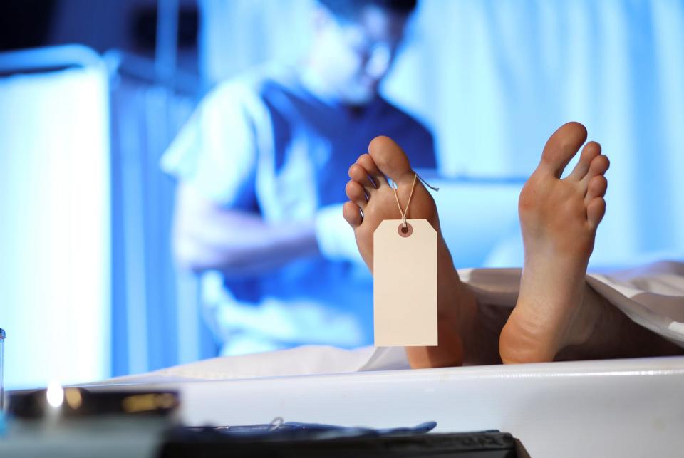 <span class="caption">While doctors and nurses have received well-deserved praise for their service on the frontlines, medical examiners and coroners perform dangerous work in the shadows.</span> <span class="attribution"><a class="link " href="https://www.gettyimages.com/detail/photo/medical-examiner-with-corpse-in-morgue-royalty-free-image/1009504454?adppopup=true" rel="nofollow noopener" target="_blank" data-ylk="slk:fstop123/E+ via Getty Images;elm:context_link;itc:0;sec:content-canvas">fstop123/E+ via Getty Images</a></span>