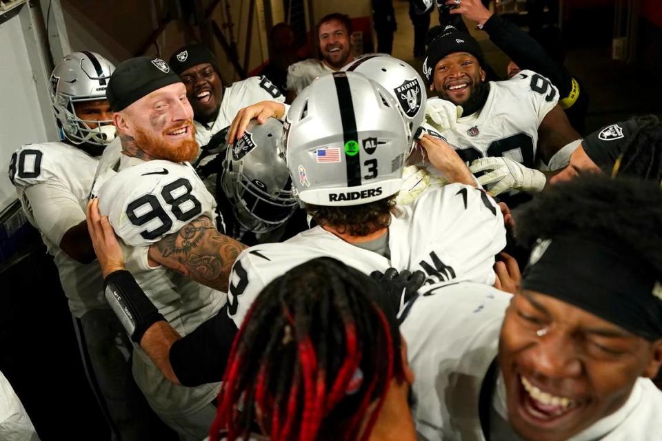 Las Vegas Raiders players celebrate after an NFL game against the Denver Broncos in Denver, Sunday, Nov. 20, 2022.