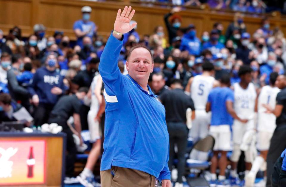 New Duke football coach Mike Elko acknowledges the crowd as he is introduced during Duke basketball game against S.C. State at Cameron Indoor Stadium in Durham, N.C., Tuesday, December 14, 2021.