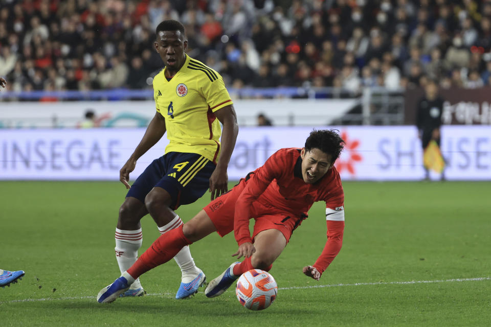 South Korea's Son Heung-min is fouled by Colombia's Carlos Cuesta during their friendly soccer match between South Korea and Colombia in Ulsan, South Korea, Friday, March 24, 2023. (Kim Do-hun/Yonhap via AP)