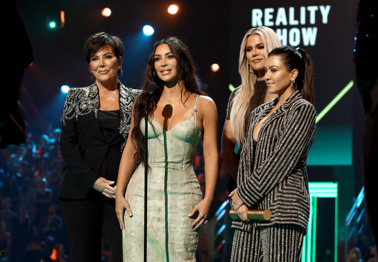 2019 E! PEOPLE'S CHOICE AWARDS -- Pictured: (l-r) Kris Jenner, Kim Kardashian, Khloé Kardashian, and Kourtney Kardashian accept The Reality Show of 2019 for 'Keeping Up with the Kardashians' on stage during the 2019 E! People's Choice Awards held at the Barker Hangar on November 10, 2019 