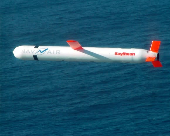 A Tomahawk missile flying over the ocean.