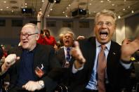 European Space Agency (ESA) Director General Jean-Jacques Dordain (L) and European Space Operations Centre (ESOC) Director General Thomas Reiter react after ESA's satellite Rosetta resent a signal to ESOC in Darmstadt January 20, 2014. Comet-chasing spacecraft Rosetta woke from nearly three years of hibernation on Monday to complete a decade-long deep space mission that scientists hope will help unlock some of the secrets of the solar system. Rosetta, which was launched by the ESA in 2004, is due to rendezvous with comet 67P/Churyumov-Gerasimenko and land a probe on it this year in an unprecedented manoeuvre. (REUTERS/Ralph Orlowski)