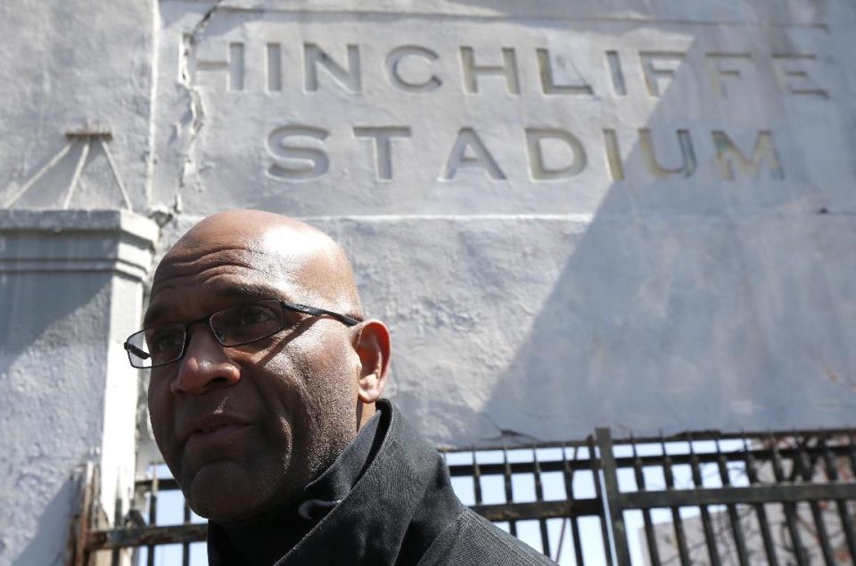 Larry Doby, Jr., the son of Larry Doby, a baseball player who integrated Major League Baseball's American League in July 1947, just months after Jackie Robinson broke the National League's color barrier, stands outside of Hinchliffe Stadium, Wednesday, April 16, 2014, in Paterson, N.J. Hinchliffe Stadium, where Doby Sr. played high school football before playing in the Negro League with the Newark Eagles, was once home to the New York Black Yankees, the New York Cubans and other Negro League baseball teams. Eleven members of the National Baseball Hall of Fame played there, including Larry Doby. The crumbling Art Deco stadium was granted national historic landmark status in 2013. Lawmakers are pushing to designate it as part of the nearby Great Falls National Historical Park. (AP Photo/Julio Cortez)