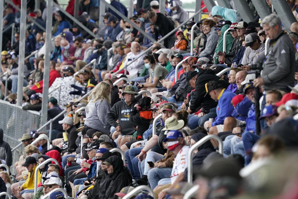 Fans watch during the final practice session for the Indianapolis 500 auto race at Indianapolis Motor Speedway, Friday, May 28, 2021, in Indianapolis. (AP Photo/Darron Cummings)