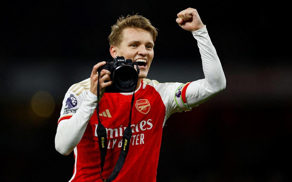 Arsenal's Martin Odegaard celebrates with a camera/Gabriel: Arsenal’s unheralded hero finally gets his flowers