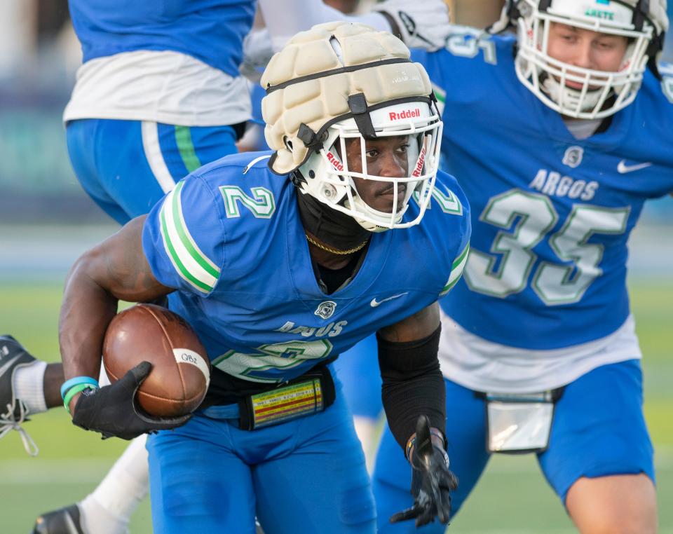 Shannon Showers (2) runs with the ball after intercepting it during the spring football game at the University of West Florida in Pensacola on Thursday, April 14, 2022.