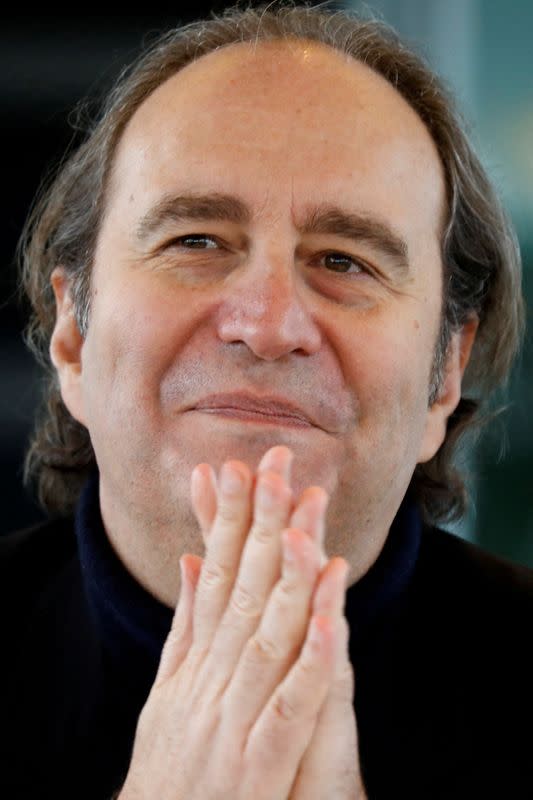 FILE PHOTO: Xavier Niel, founder and majority-owner of French broadband Internet provider Iliad attends the company's 2017 annual results presentation in Paris