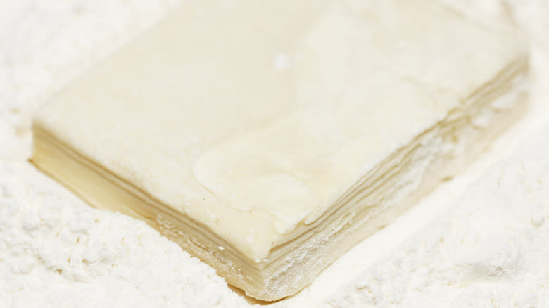 Sheets of dough in flour