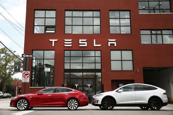 Teslas are parked outside a Brooklyn, New York, showroom, July 5, 2016.