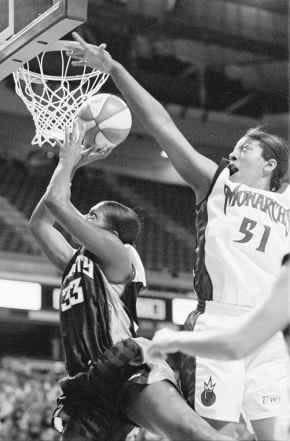 New York Liberty center Trena Trice tries to get a shot off under thedefense of Sacramento Monarch\'s forward Latasha Byears during thefirst half of the game Thursday at Arco Arena in Sacramento. New Yorkwon the game, 64-48. AP photo