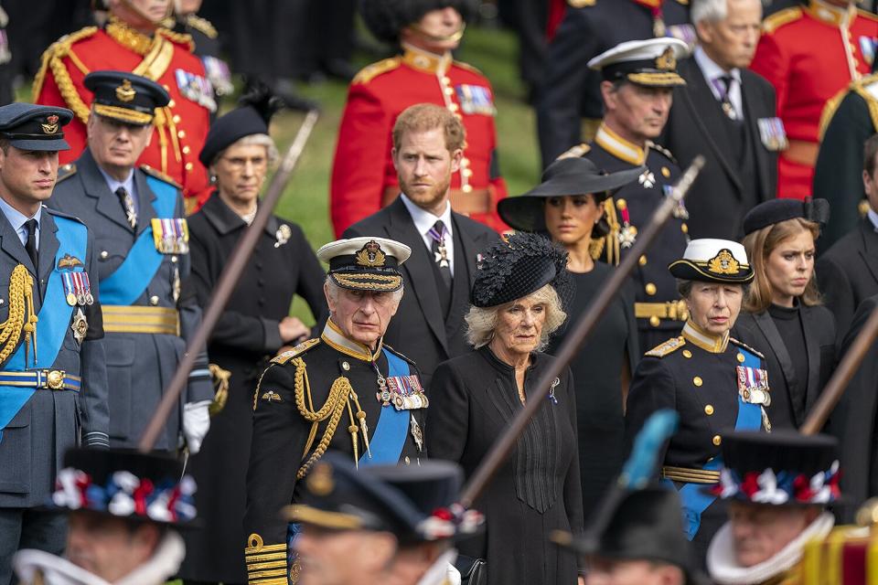 The Prince of Wales, King Charles III, the Duke of Sussex, the Queen Consort, the Duchess of Sussex and the Princess Royal look on as the State Gun Carriage carrying the coffin of Queen Elizabeth II arrives at Wellington Arch during the Ceremonial Procession following her State Funeral at Westminster Abbey, London.