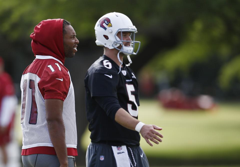 Cardinals receiver Larry Fitzgerald, left, tweeted that quarterback Drew Stanton played the final two games of the season on a torn ACL. (AP)