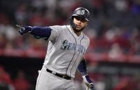 Seattle Mariners' Omar Narvaez points to his dugout as he round first after hitting a solo home run during the ninth inning of the team's baseball game against the Los Angeles Angels on Friday, April 19, 2019, in Anaheim, Calif. (AP Photo/Mark J. Terrill)