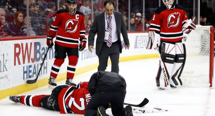 John Moore lays on the ice after being hit from behind by Tom Wilson. (Julio Cortez/AP)