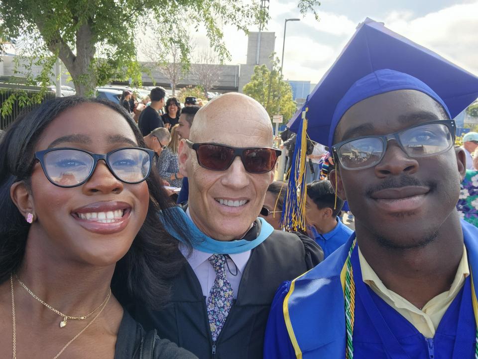 Larry Strauss, a teacher at Middle College High School in Los Angeles, celebrates in June 2024 with graduating student Zimako Ezechukwu and his sister, Cheta Ezechukwu, who graduated from there the year prior.