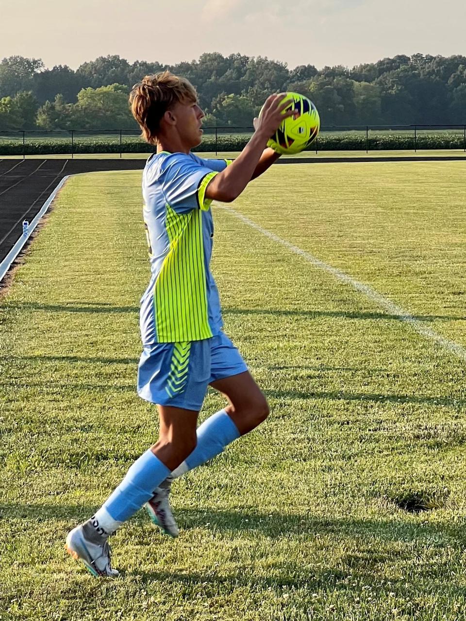 River Valley's Hudson Pollock throws in a ball during a boys soccer match at home against Marion Harding this season.