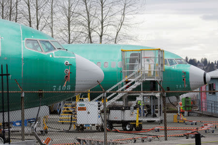 Two Boeing 737 MAX 8 aircraft are parked at a Boeing production facility in Renton, Washington, U.S., March 11, 2019. REUTERS/David Ryder
