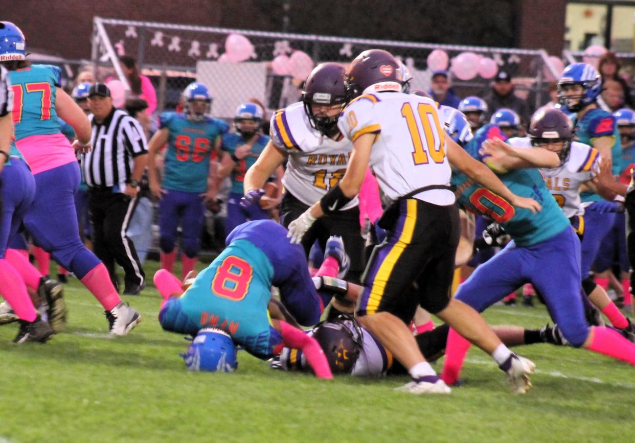 Somersworth's Tayshawn Sheppard (8) tries to squeeze through the Mascoma Valley defense during Friday night's Division IV contest.