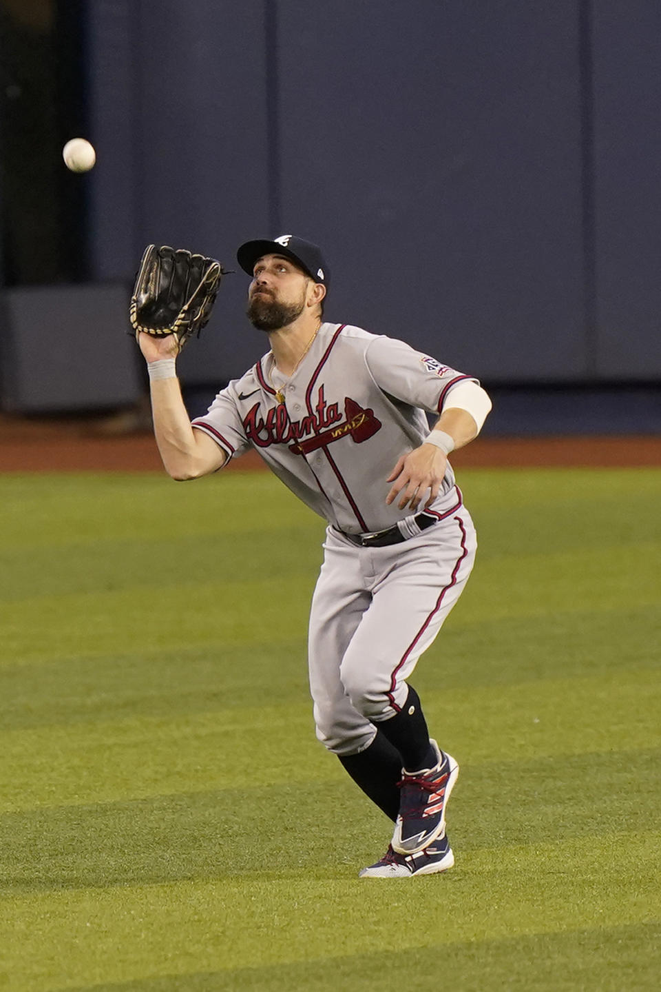 Atlanta Braves center fielder Ender Inciarte catches a sacrifice fly hit by Miami Marlins' Jesus Aguilar that scored Jazz Chisholm Jr. during the first inning of a baseball game, Saturday, June 12, 2021, in Miami. (AP Photo/Wilfredo Lee)