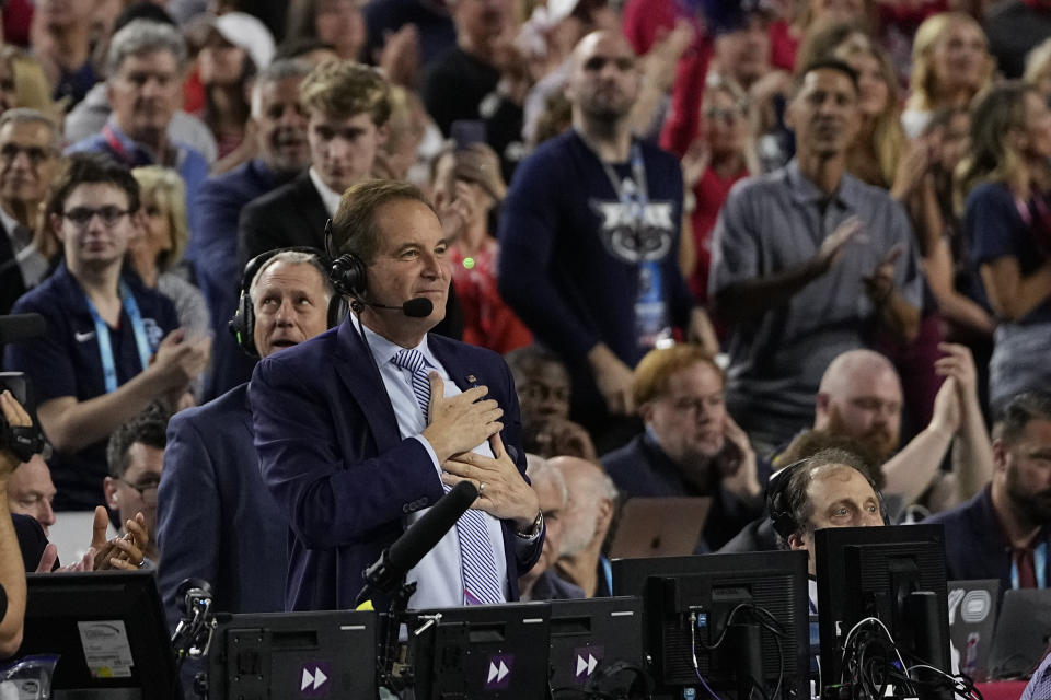 Jim Nantz waves to the crowd during the Florida Atlantic and San Diego State Final Four college basketball game in the NCAA Tournament on Saturday, April 1, 2023, in Houston. Nantz's near four-decade career covering March Madness ends after Monday's final between UConn and San Diego State. (AP Photo/David J. Phillip)