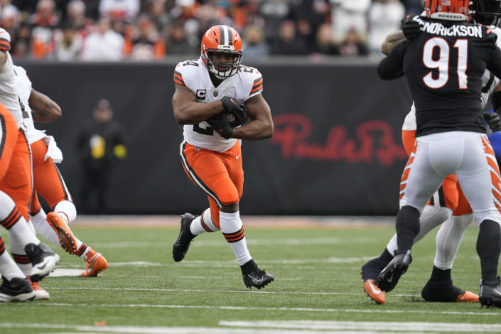 Cleveland Browns' Nick Chubb (24) runs during the first half of an NFL football game against the Cincinnati Bengals, Sunday, Dec. 11, 2022, in Cincinnati. (AP Photo/Jeff Dean)