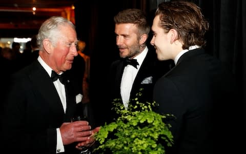 Prince Charles talks with David Beckham and Brooklyn Beckham during the global premiere of Netflix's Our Planet - Credit: JOHN SIBLEY